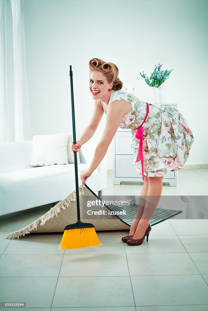 Retro housewife sweeping