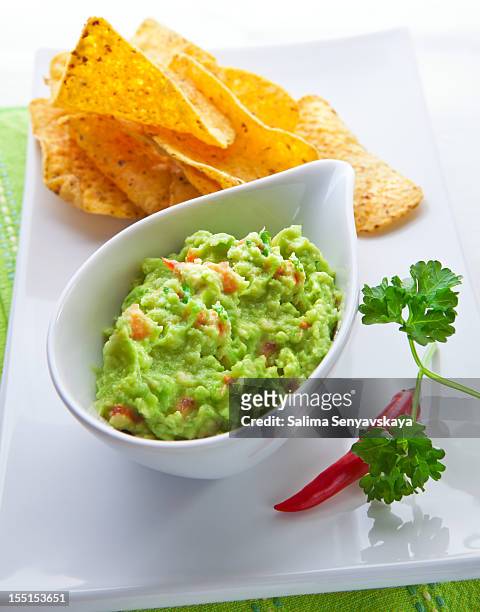 fresh guacamole - guacamole stock pictures, royalty-free photos & images