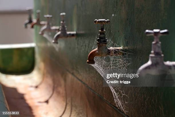 old wash trough and taps - dehydration stock pictures, royalty-free photos & images