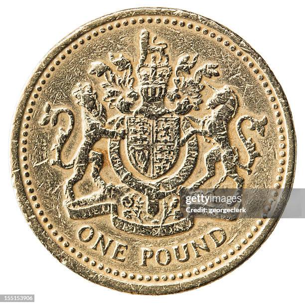 worn uk pound coin close-up - old pound coin stock pictures, royalty-free photos & images