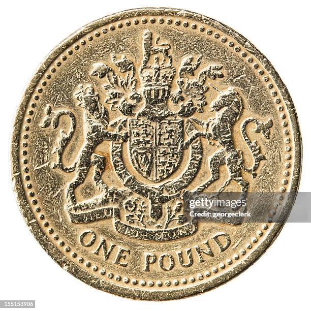 worn uk pound coin close-up - pound coins stock pictures, royalty-free photos & images