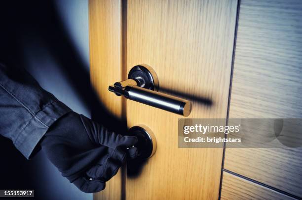 gloved hand opening the door - burglary stock pictures, royalty-free photos & images
