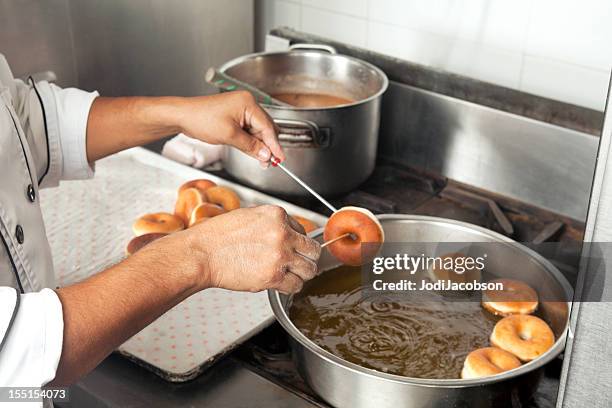 frying donuts - fried dough stock pictures, royalty-free photos & images