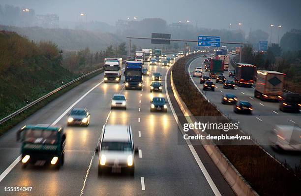 german motorway early in the morning - trucks on queue stock pictures, royalty-free photos & images