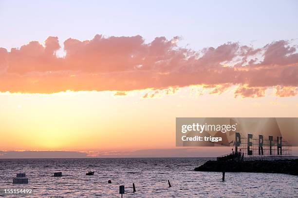 fremantle harbour, australia, at sunset with perth sign - fremantle stock pictures, royalty-free photos & images