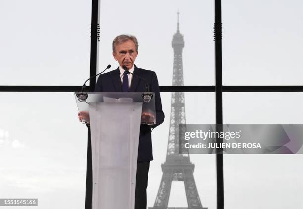 World's top luxury group LVMH head Bernard Arnault delivers a speech during a meeting after LVMH was named as final premium sponsor of 2024 Paris...