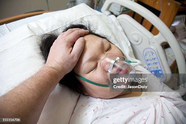 woman in a hospital bed - person on ventilator stock pictures, royalty-free photos & images