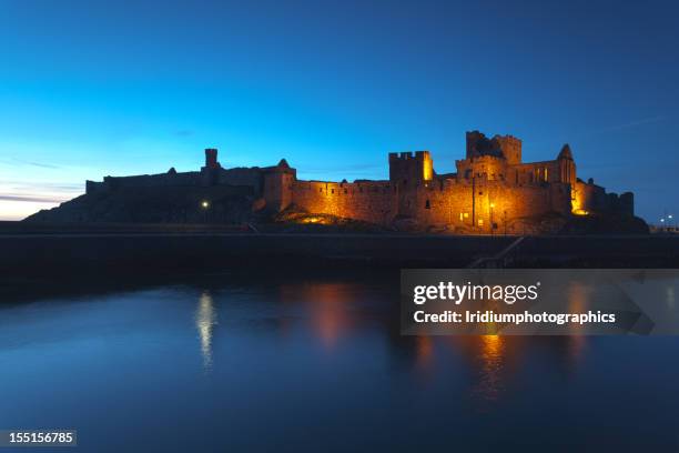 peel castle at night, isle of man - isle of man stock pictures, royalty-free photos & images