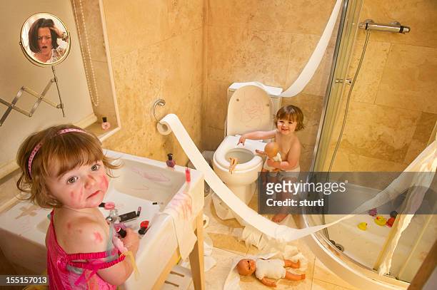 twin trouble - children misbehaving stock pictures, royalty-free photos & images