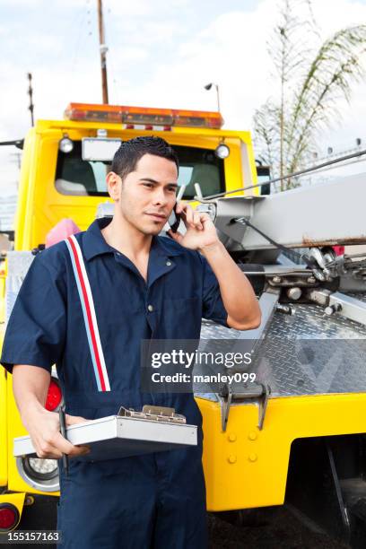tow truck worker on the phone - towing stock pictures, royalty-free photos & images