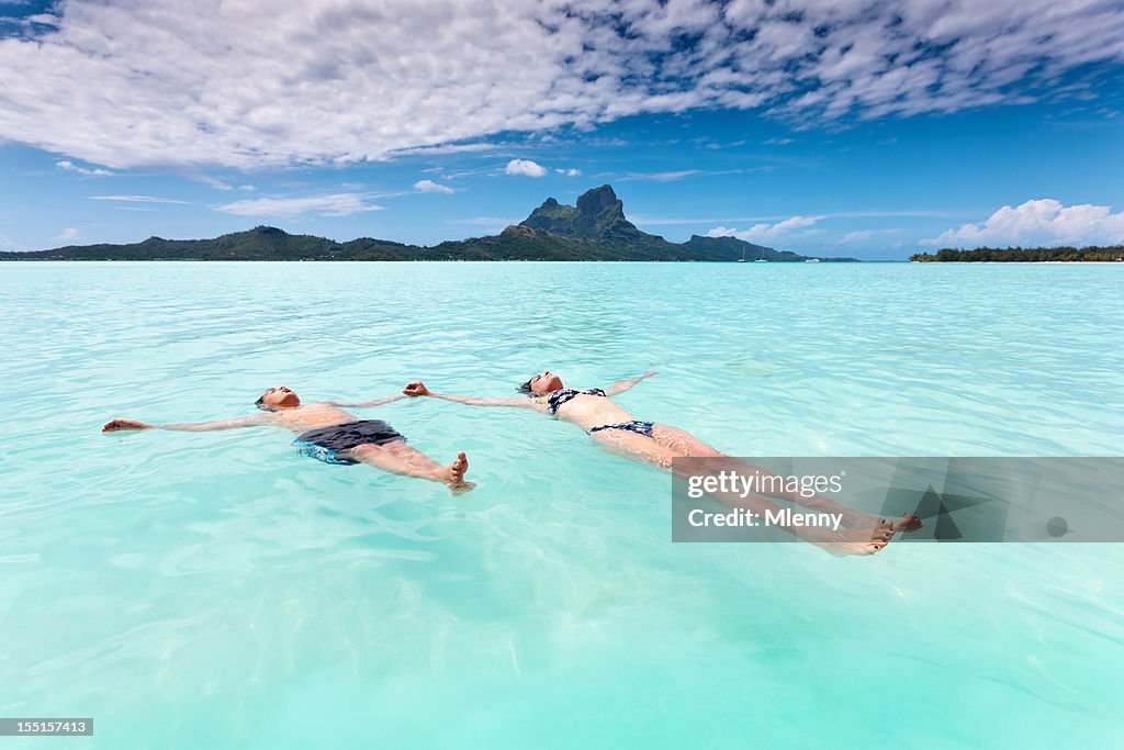 Mother and Son relaxing in Bora-Bora Lagoon