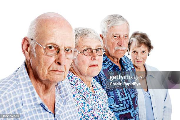 four frowning seniors show disapproval and disappointment - grumpy old man stock pictures, royalty-free photos & images