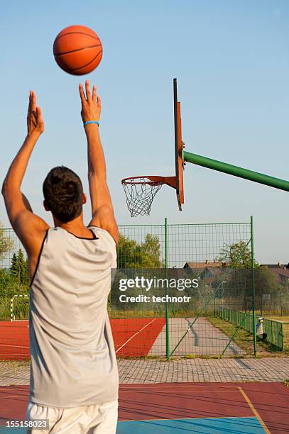 basketball shooting action - jump shot basketball stock pictures, royalty-free photos & images