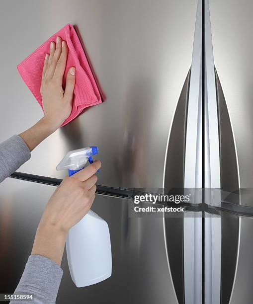 cleaning surface of refrigerator - vod stockfoto's en -beelden
