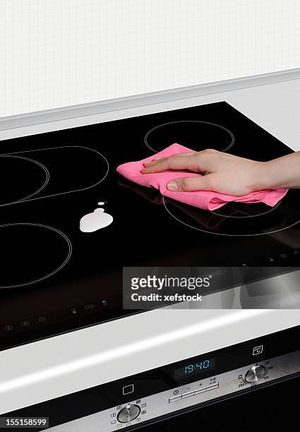 cleaning set-top stove - stove top stock pictures, royalty-free photos & images