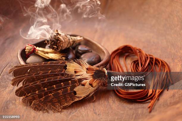 sage stick and american indian feather - ceremony stock pictures, royalty-free photos & images