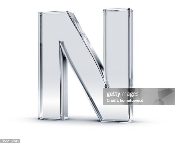 tall silver letter n with a slight shadow beneath it - 3d alphabet stock pictures, royalty-free photos & images