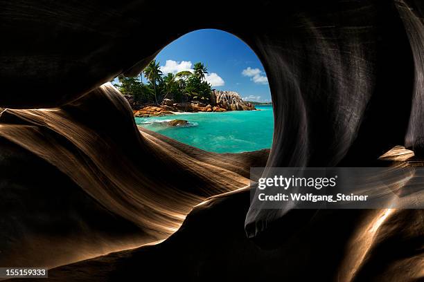 view from a cave - seychelles stock pictures, royalty-free photos & images