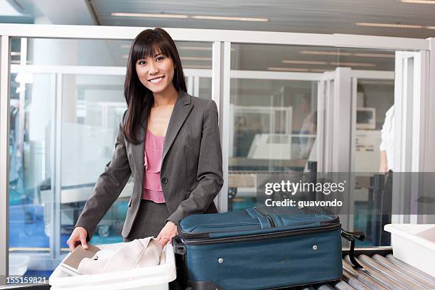 airport security, asian young woman on business travel, smiling - customs agent stock pictures, royalty-free photos & images