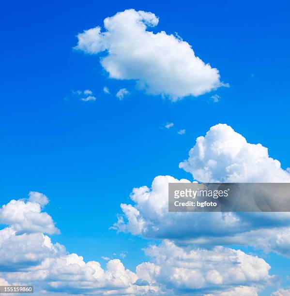 bright blue sky with puffy clouds - fluffy cloud sky stock pictures, royalty-free photos & images
