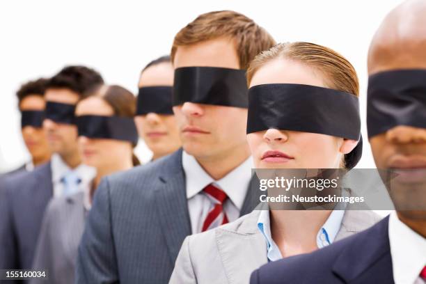 business people in blindfolds - blinddoek stockfoto's en -beelden