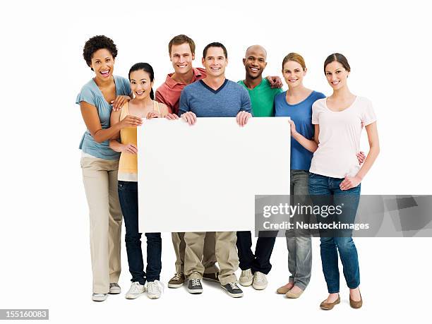 young adults holding up a blank sign - isolated - blank sign stock pictures, royalty-free photos & images