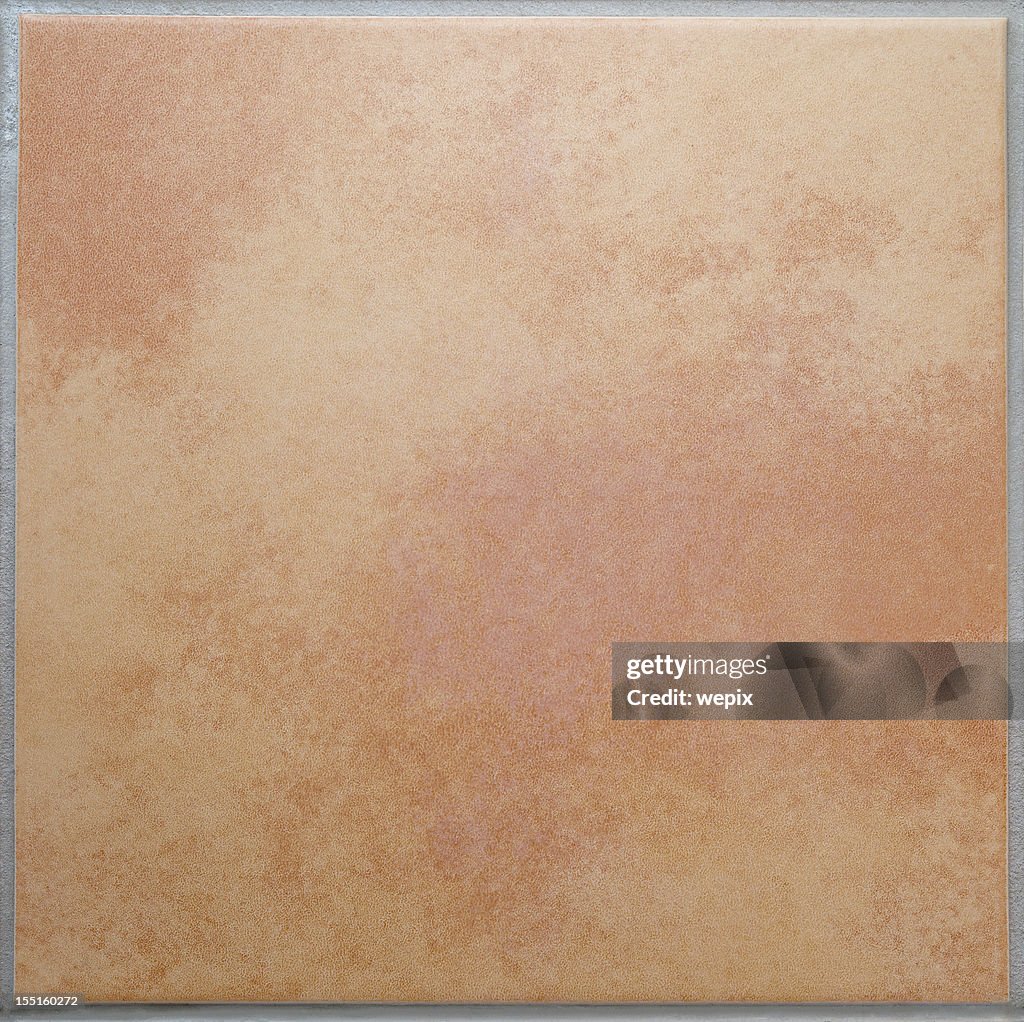 One apricot colored terracotta tile isolated background XL