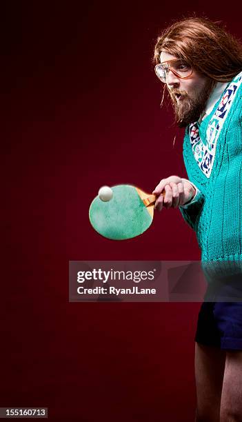 goofy nerd with bad sweater plays table tennis - funny ping pong stock pictures, royalty-free photos & images