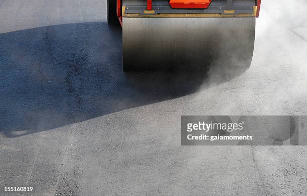 steamroller in action - asphalt paver stock pictures, royalty-free photos & images