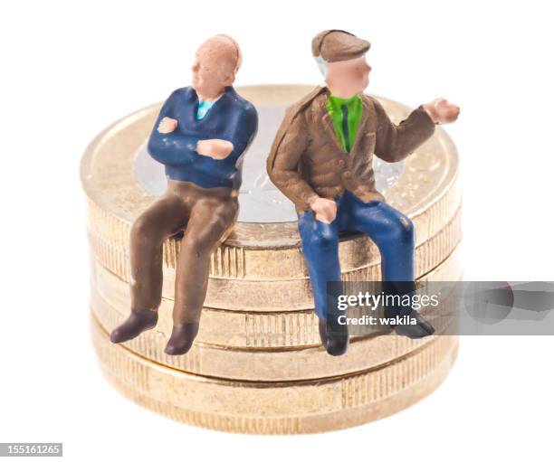 old-age pension - pensioners on euro coins - beeldje stockfoto's en -beelden