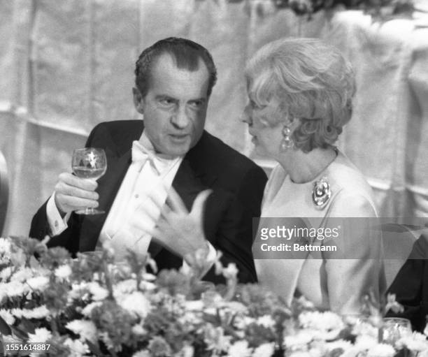 President Richard Nixon chats with Madame Claude Pompidou during a banquet at the Waldorf-Astoria honoring the French President Pompidou. Nixon made...