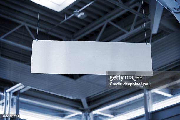 hanging metal billboard in business room - banner sign stock pictures, royalty-free photos & images