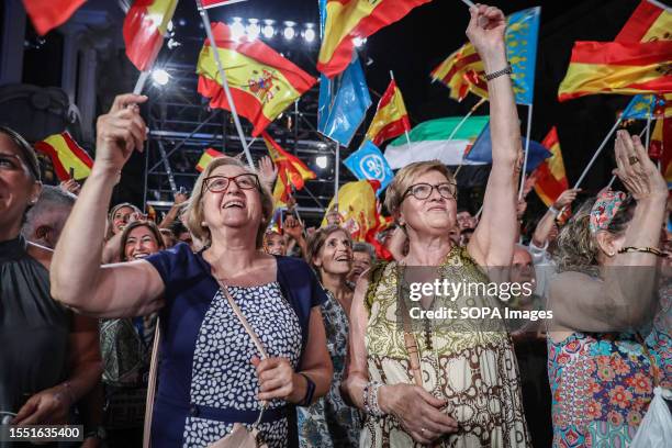 Group of supporters of the Popular Party with Spanish flags celebrate the victory of their party at the PP headquarters during the vote count. Dozens...