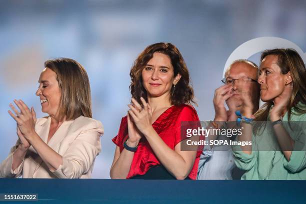Isabel Diaz Ayuso , president of the Community of Madrid, observes the supporters gathered in the surroundings from the balcony of the popular party...