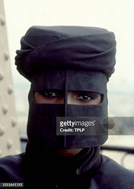 Jamaican-American model Grace Jones, is May Day, dressed in costume on the Eiffel Tower during the filming of the 1985 James Bond spy movie, A View...