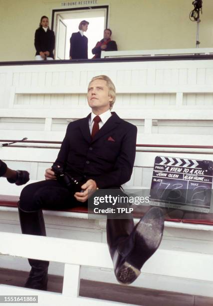 American actor Christopher Walken, is Max Zorin, dressed in costume, sits in the stands at Royal Ascot Racecourse during the filming of the 1985...