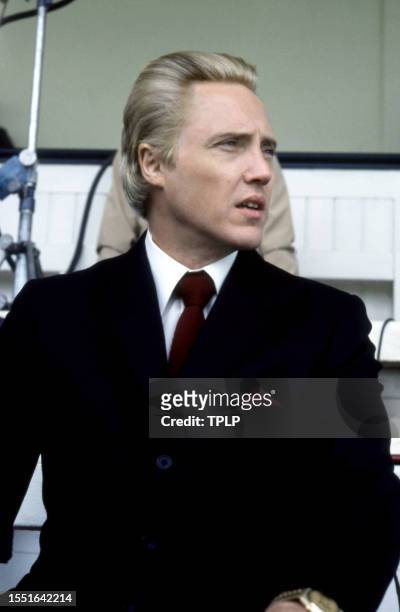 American actor Christopher Walken, is Max Zorin, dressed in costume, sits in the stands at Royal Ascot Racecourse during the filming of the 1985...