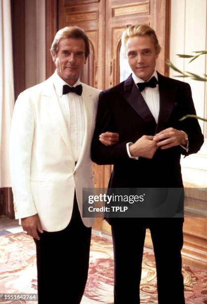 English actor Roger Moore , is James Bond and American actor Christopher Walken, is Max Zorin, both dressed in costume, pose for a portrait during...