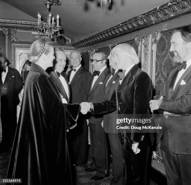 English television presenter Jimmy Savile meets Prince Rainier III and Princess Grace of Monaco , circa 1980.