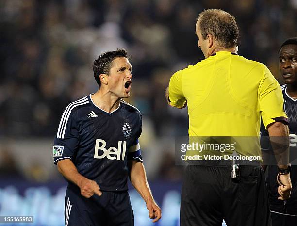 John Thorrington of the Vancouver Whitecaps protests a penatly kick call by referee Silviu Petrescu in the second half during the MLS playoff match...