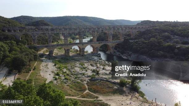 View of The Pont du Gard, a Roman aqueduct bridge which was built to carry water in the first century, dazzles visitors due to its historical value...