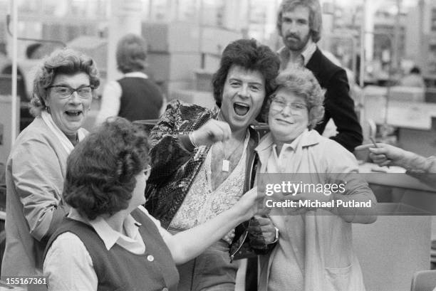 English pop singer Gary Glitter with fans, 9th April 1974.