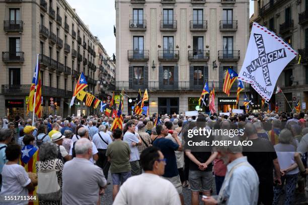 Demonstrators take part in a protest called by the Catalan National Assembly a day after Spain's general election, in Barcelona on July 24, 2023. The...