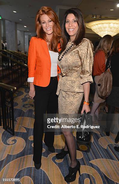 Actress Angie Everhart and News host Christine Devine arrive to the Lupus LA 10th Anniversary Hollywood Bag Ladies Luncheon at Regent Beverly...