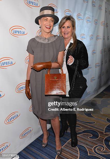 Actress Sharon Stone and sister Kelly Stone arrive to the Lupus LA 10th Anniversary Hollywood Bag Ladies Luncheon at Regent Beverly Wilshire Hotel on...