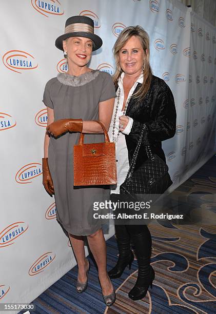 Actress Sharon Stone and sister Kelly Stone arrive to the Lupus LA 10th Anniversary Hollywood Bag Ladies Luncheon at Regent Beverly Wilshire Hotel on...