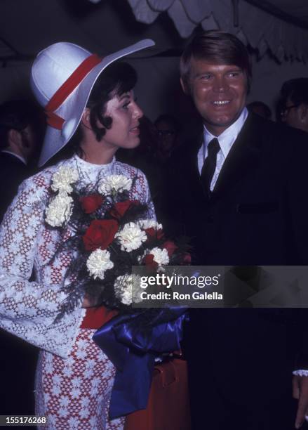 Musician Glen Campbell and Billie Jean Nunley attend Honor America Day on July 4, 1970 in Washington, D.C.