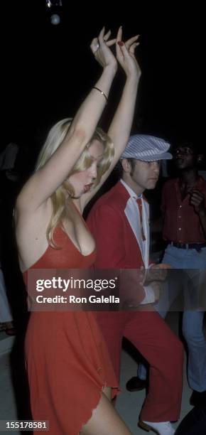 Cheryl Rixon and Elton John attend the party for Roberta Flack on June 12, 1978 at Xenon Disco in New York City.