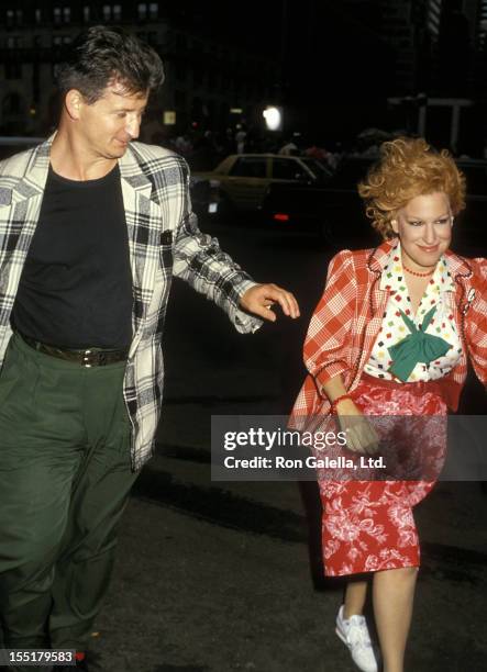 Singer Bette Midler is escorted by her husband Martin von Haselberg to the film set of "Big Business" on August 10, 1987 at The Plaza Hotel in New...