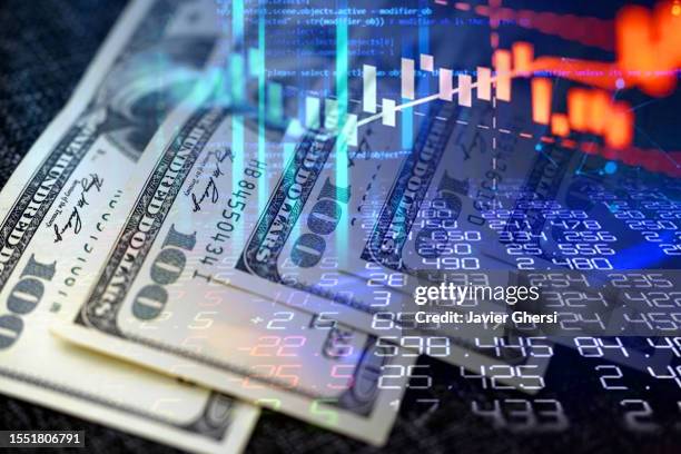 cash dollar bills and stock market indicators - inflation photos et images de collection
